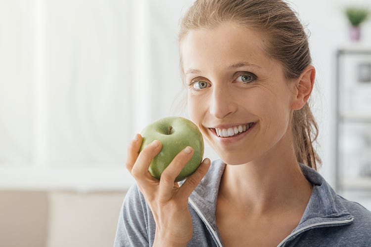 hero-burining-questions-woman-holding-an-apple