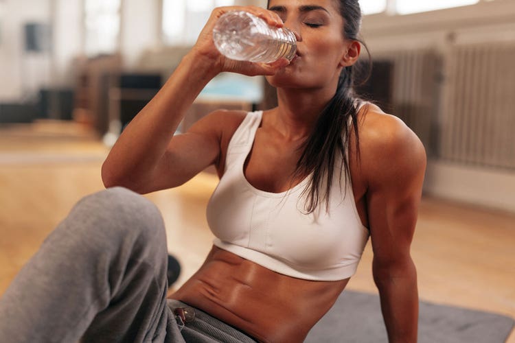 3-woman-drinking-water-during-a-workout