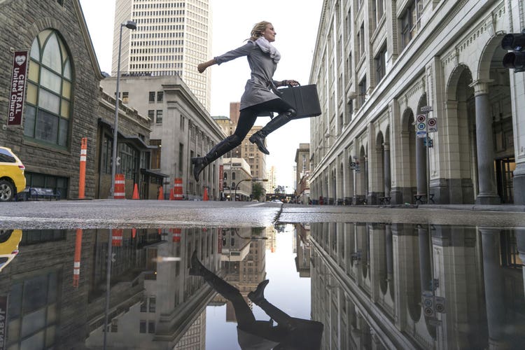hero-woman-jumping-in-the-street
