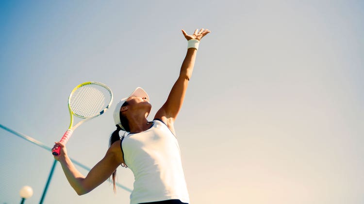 hero-body-electric-woman-playing-tennis